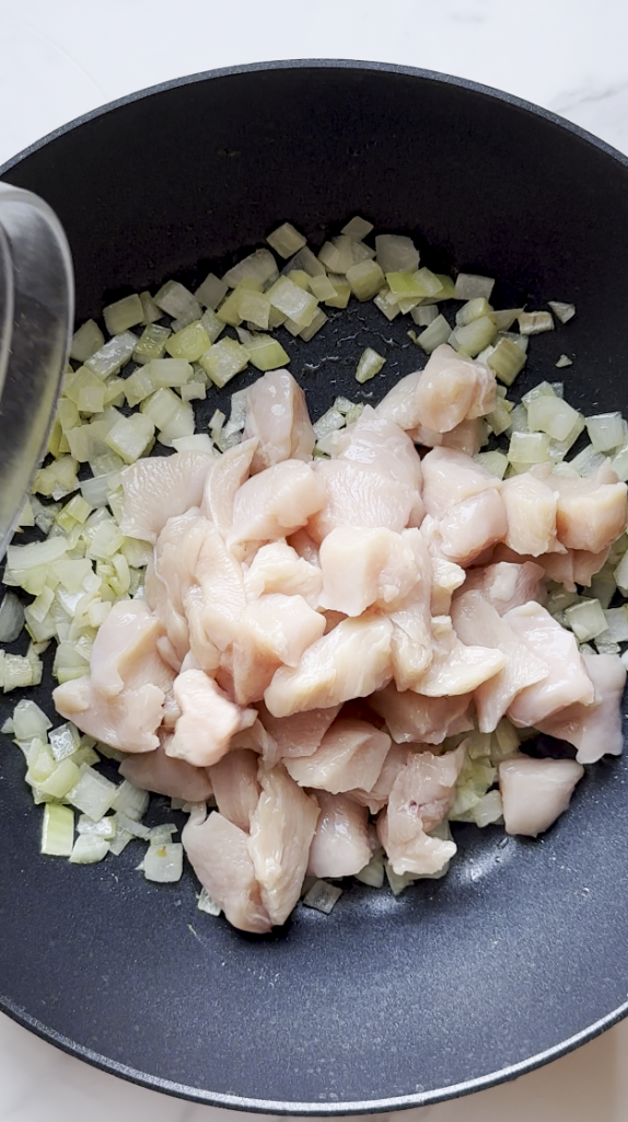 with diced onions and cut up chicken